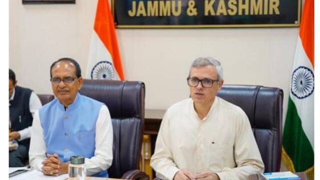 Two ministers sitting in a meeting